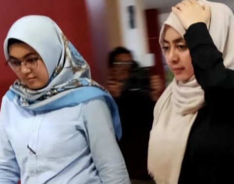 MS saat menuju ruang pemeriksaan Polda Riau.