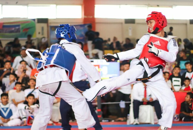 Atlet Taekwondo saat bertanding.