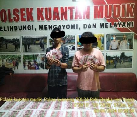 Dua warga asal Kota Pekanbaru ditangkap akibat edarkan uang palsu di Kuansing (foto/ultra)