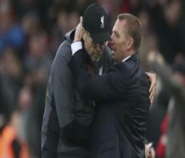 Jurgen Klopp dan eks pelatih Liverpool Brendan Rodgers. Foto: CNNIndonesia