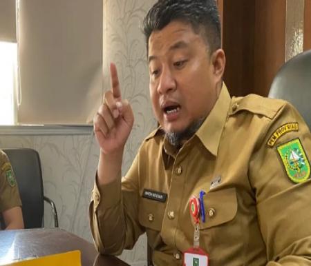Kepala Dinas Tenaga Kerja dan Transmigrasi Provinsi Riau, Imron Rosyadi (foto/int)